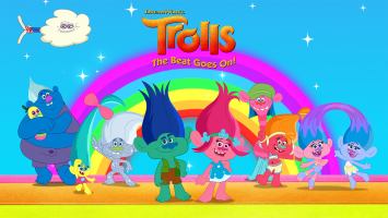 Colourful animated alien like figures posing in front of a rainbow 